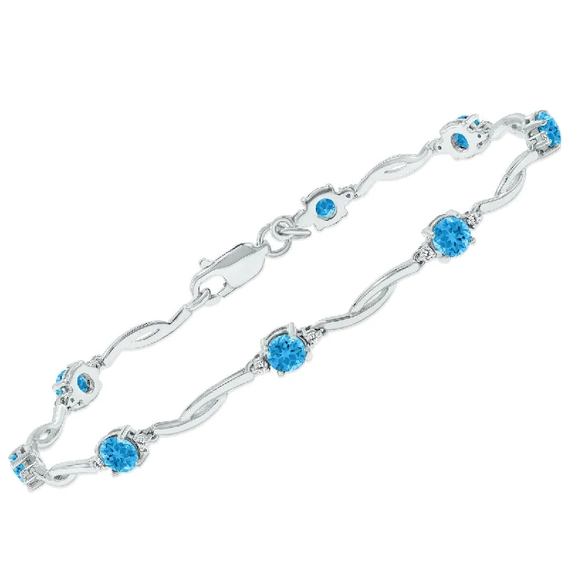 Marquee Blue Topaz and Natural Diamond Braided Wave Bracelet in .925 Sterling Silver