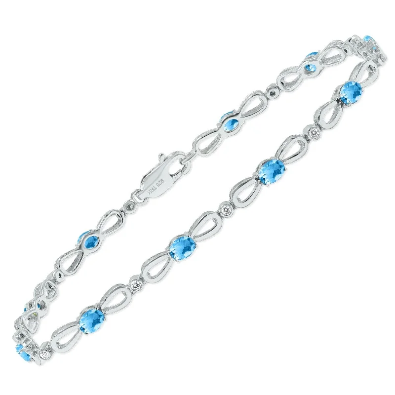 Marquee Blue Topaz and Natural Diamond Ribbon Loop Bracelet in .925 Sterling Silver