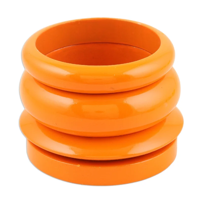 Novica Handmade Orange Fusion Mango Wood Bangle Bracelets (Set Of 4)