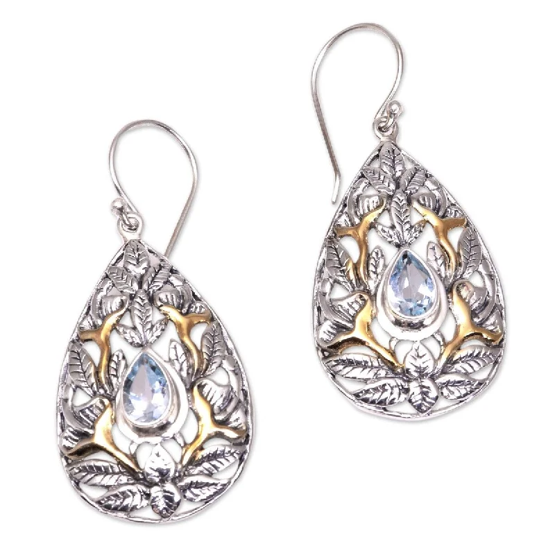 NOVICA Hidden Jungle, Gold accented blue topaz dangle earrings - 1.8*0.8